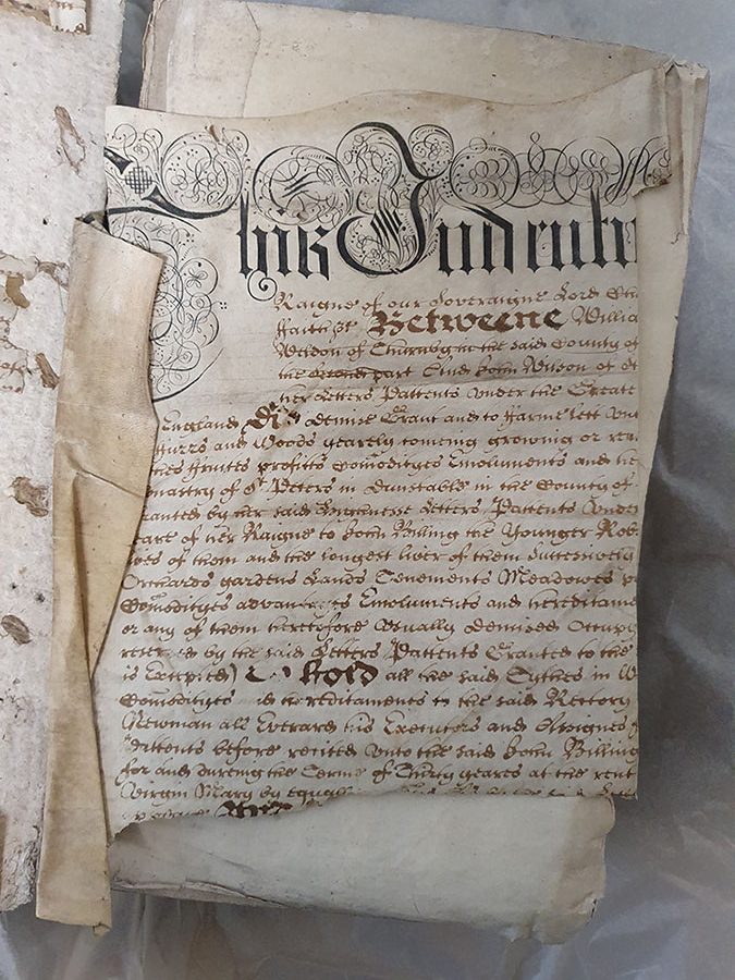 Parchment indenture scrapped for use to a 17th century volume