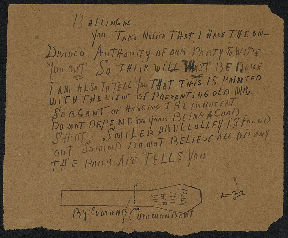 Handwritten letter on brown paper 