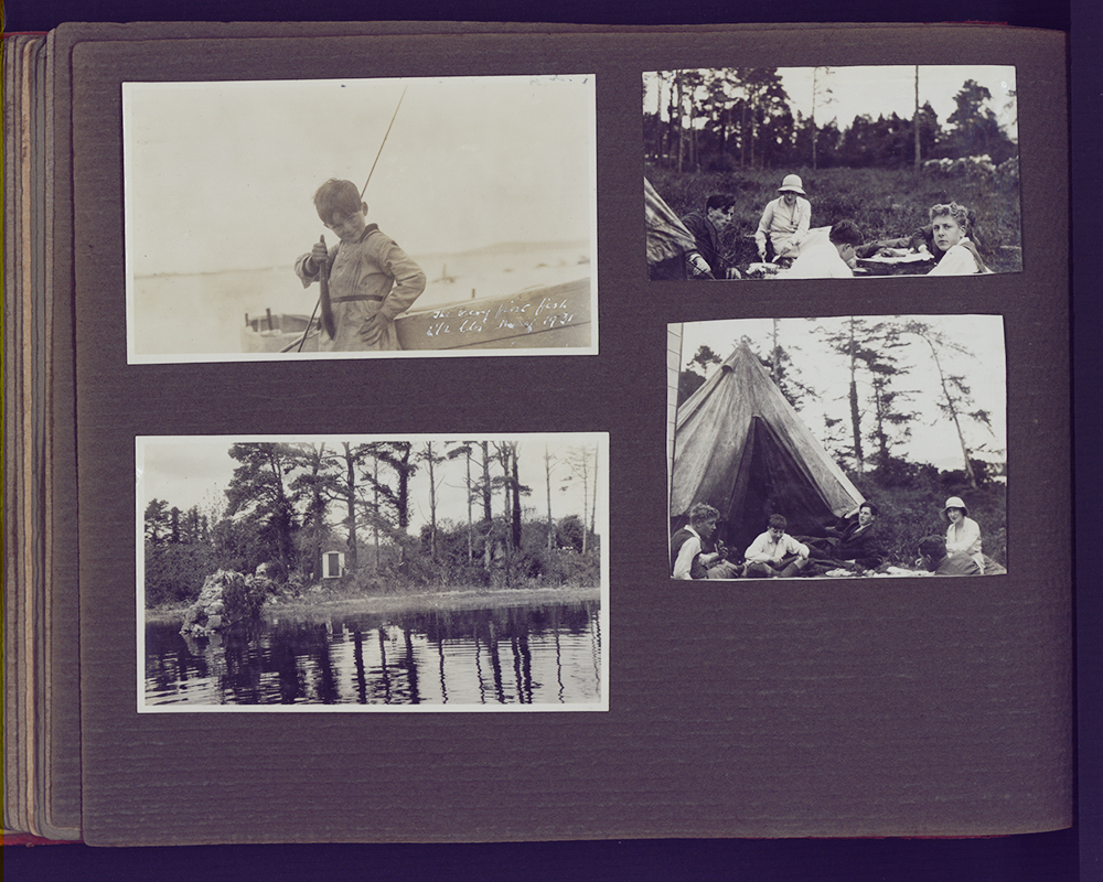 Four black and white photographs stuck to a larger grey page
